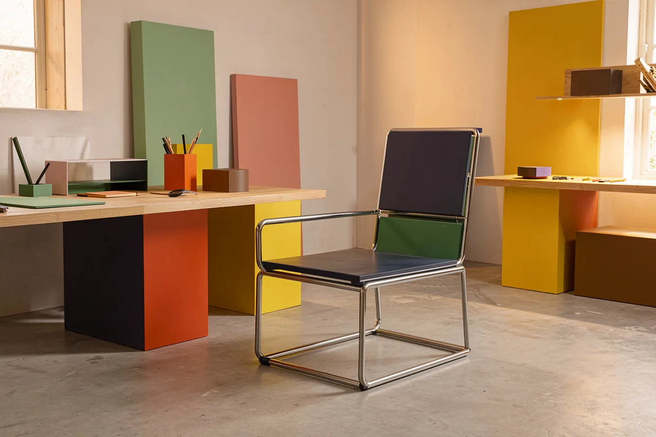 Bauhaus tubular steel cantilever chair and geometric furniture studies in primary colors