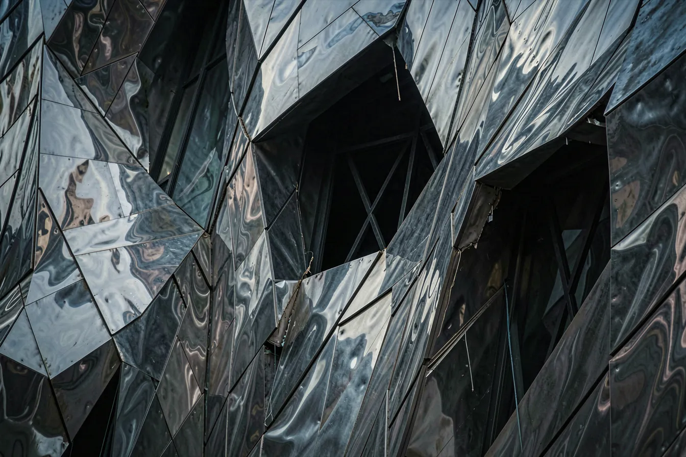 Fractured deconstructivist metal facade with colliding planes