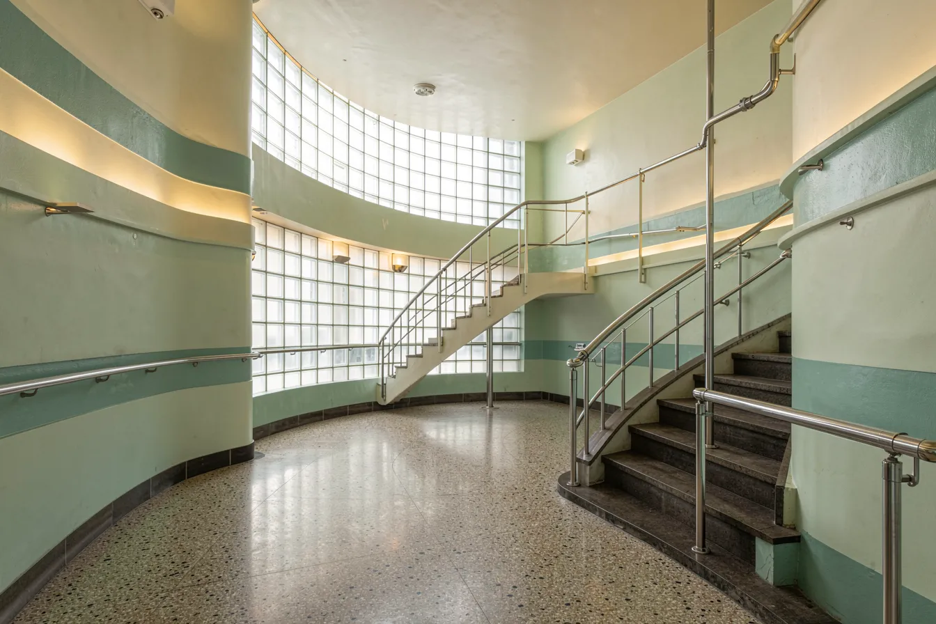 Interior of a Streamline Moderne transit hall with glass block and chrome railings
